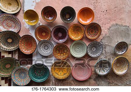 Stock Image - painted dishes for sale in the ancient medina in Marrakech, Morocco. Fotosearch