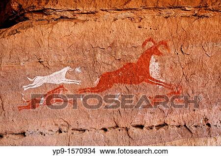 Picture - Painted hunting scene, rock art in the Akakus Mountains, Sahara Desert, Libya. Fotosearch
