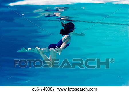 Stock Photo - Painted image of young girl swimming under water. Fotosearch