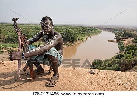 painted Karo warrior in Kolcho on the Omo River, Ethiopia. View Large Photo Image Stock Photograph - painted Karo warrior in Kolcho on the Omo River, Ethiopia.. Fotosearch
