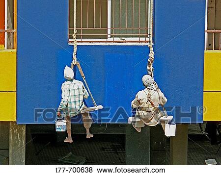 Painters are seating on cradles and working on a building's exterior painting work Pune, Maharashtra, India View Large Photo Image Stock Photo - Painters are seating on cradles and working on a building's exterior painting work Pune, Maharashtra, India. Fotosearch