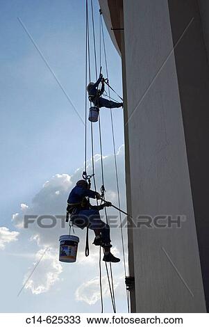 Stock Image - Painters at the Bayoke Sky hotel, topmost building from Thailand, Bangkok. Fotosearch