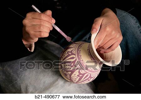 Stock Photo - Painting typical Fes ceramic, at? Serghini-Poterie de Fes?, at A? n Nokbi, outside Fes. Morocco.. Fotosearch