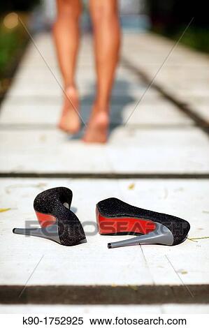 Stock Photography - Pair of high heels laying on the floor. Fotosearch