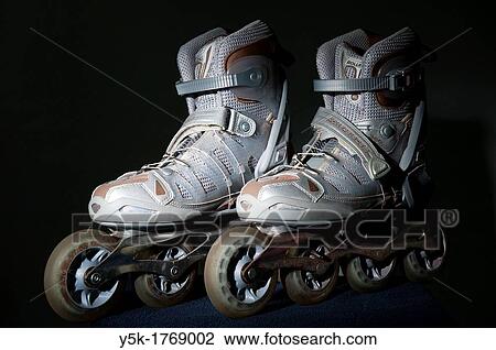 Pair of inline skates. Studio-image against black background. View Large Photo Image Stock Image - Pair of inline skates. Studio-image against black background.. Fotosearch