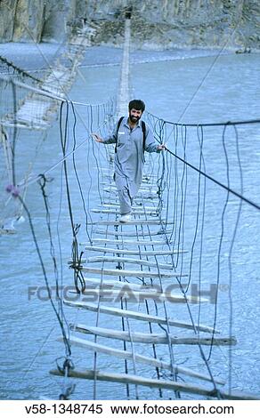 Pakistan, Hunza valley, Gulmit region, Suspension bridge over Hunza river View Large Photo Image Stock Photography - Pakistan, Hunza valley, Gulmit region, Suspension bridge over Hunza river. Fotosearch