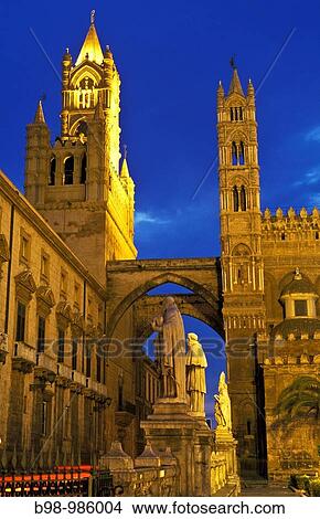 Palermo, Sicily, Italy Tower of cathedral of Santa Maria Assunta Saint Mary of the Assumption lit at twilight / night Building constructed in Norman Arab style View Large Photo Image Picture - Palermo, Sicily, Italy Tower of cathedral of Santa Maria Assunta Saint Mary of the Assumption lit at twilight / night Building constructed in Norman Arab style. Fotosearch