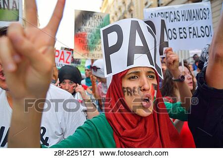 Palestinian woman demanding peace and protesting against Israeli attacks in the Gaza Strip during a demonstration in Madrid on July 18, 2014. Madrid. Spain. View Large Photo Image Stock Image - Palestinian woman demanding peace and protesting against Israeli attacks in the Gaza Strip during a demonstration in Madrid on July 18, 2014. Madrid. Spain.. Fotosearch