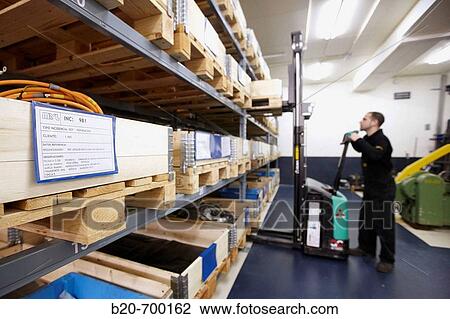 Pallets in warehouse, forklift, spindle manufacturing. Mendaro, Gipuzkoa, Euskadi, Spain View Large Photo Image Stock Image - Pallets in warehouse, forklift, spindle manufacturing. Mendaro, Gipuzkoa, Euskadi, Spain. Fotosearch