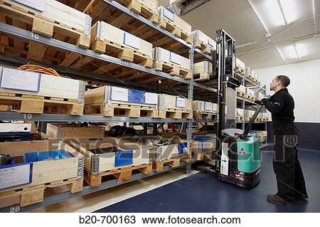 Pallets in warehouse, forklift, spindle manufacturing. Mendaro, Gipuzkoa, Euskadi, Spain View Large Photo Image Stock Image - Pallets in warehouse, forklift, spindle manufacturing. Mendaro, Gipuzkoa, Euskadi, Spain. Fotosearch