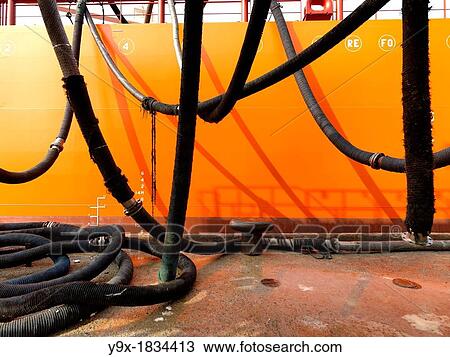 Palm oil transported to a tanker by an intricate system of tubes View Large Photo Image Stock Image - Palm oil transported to a tanker by an intricate system of tubes. Fotosearch