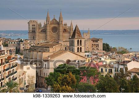 Palma Cathedral La Seu sigloIV-XVI and church of La Santa Creu XIV sailor quarter Puig de Sant Pere Mallorca Palma Islas Baleares Spain View Large Photo Image Stock Image - Palma Cathedral La Seu sigloIV-XVI and church of La Santa Creu XIV sailor quarter Puig de Sant Pere Mallorca Palma Islas Baleares Spain. Fotosearch