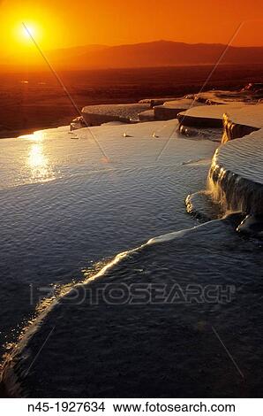 Pamukkale; Terrace Pools; Sunset; UNESCO World Heritage Site; Turkey. View Large Photo Image Picture - Pamukkale; Terrace Pools; Sunset; UNESCO World Heritage Site; Turkey.. Fotosearch