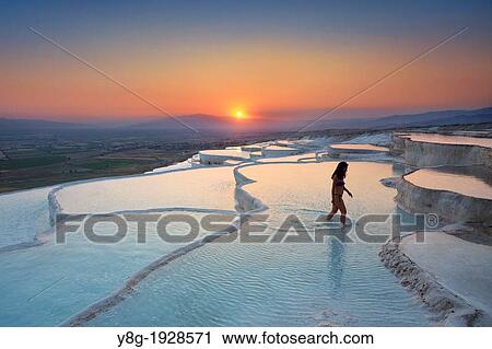 Pamukkale, woman walking on limestone terraces, Pamukkale near Denizli, Turkey View Large Photo Image Stock Image - Pamukkale, woman walking on limestone terraces, Pamukkale near Denizli, Turkey. Fotosearch