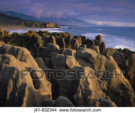 Picture - Pancake Rocks at sunset Dolomite Point Punakaiki New Zealand. Fotosearch