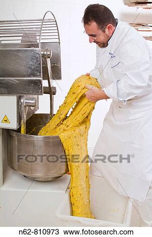 Stock Image - panettone, typical Italian sweet, cooked in the oven,. Fotosearch