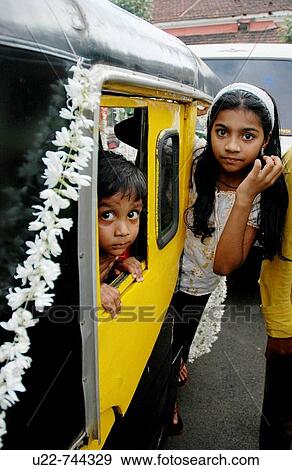 Stock Photo - Panjim Goa, India, children in a three-wheeler. Fotosearch
