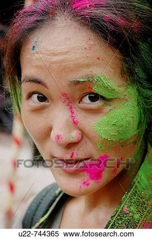 Stock Photography - Panjim Goa, India, woman with colored powder on the face during the Holi feast. Fotosearch