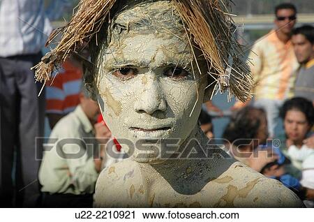 Stock Image - Panjim, Goa, India: young man at the Carnival. Fotosearch