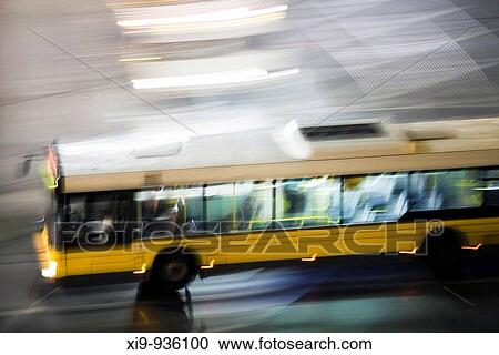 Panning shot of a bus by night, Berlin, Germany View Large Photo Image Stock Image - Panning shot of a bus by night, Berlin, Germany. Fotosearch
