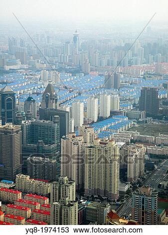 Stock Image - Panoramic view of Shanghai skyscrapers and old houses, China. Fotosearch