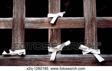Stock Photography - Paper prayers tied to a temple window in Yamadera Yamagata Japan. Fotosearch