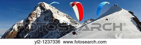 Paragliders near the Observatory at the Jungfrau Top of Europe - Swiss Alps - Switzerland View Large Photo Image Stock Photograph - Paragliders near the Observatory at the Jungfrau Top of Europe - Swiss Alps - Switzerland. Fotosearch