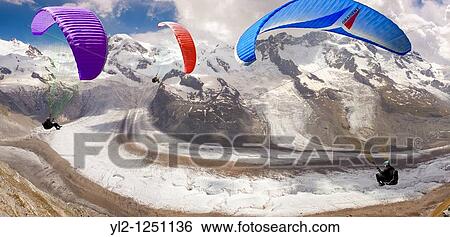 Paragliders over the Gornergletscher glacier viewed from Gornergrat. Zermatt. View Large Photo Image Stock Photograph - Paragliders over the Gornergletscher glacier viewed from Gornergrat. Zermatt.. Fotosearch