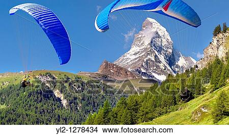 Paragliders over the Matterhorn mountain peak - Swiss Alps - Switzerland View Large Photo Image Picture - Paragliders over the Matterhorn mountain peak - Swiss Alps - Switzerland. Fotosearch