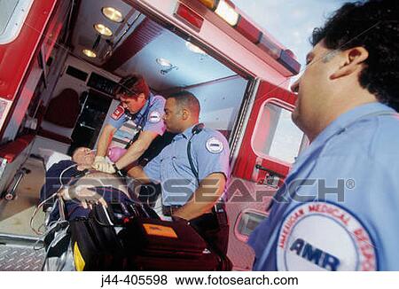 Paramedics rushing patient from ambulance to emergency in hospital View Large Photo Image Stock Photo - Paramedics rushing patient from ambulance to emergency in hospital. Fotosearch