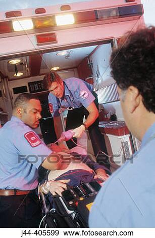 Stock Photo - Paramedics rushing patient from ambulance to emergency in hospital. Fotosearch