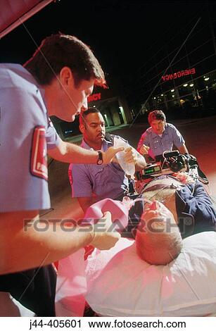 Paramedics rushing patient to emergency in hospital View Large Photo Image Stock Image - Paramedics rushing patient to emergency in hospital. Fotosearch