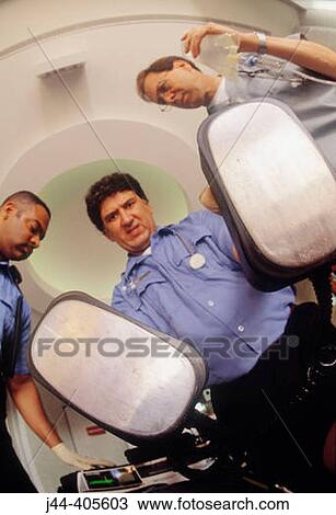 Paramedics with defibrilator in hand View Large Photo Image Stock Image - Paramedics with defibrilator in hand. Fotosearch
