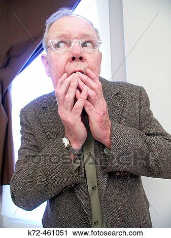 Stock Image - Paranoid Aging Man. Fotosearch