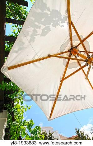 Parasol in white, Resort hotel, La Sella, Denia, Alicante, Spain View Large Photo Image Stock Image - Parasol in white, Resort hotel, La Sella, Denia, Alicante, Spain. Fotosearch