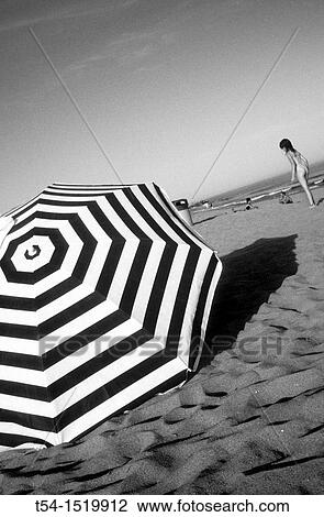 Stock Image - parasol on the beach of Barcelona. Fotosearch