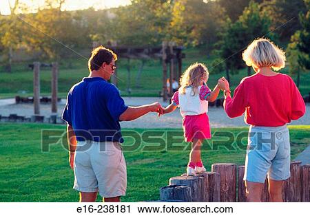 parents helping daughter balance View Large Photo Image Stock Image - parents helping daughter balance. Fotosearch
