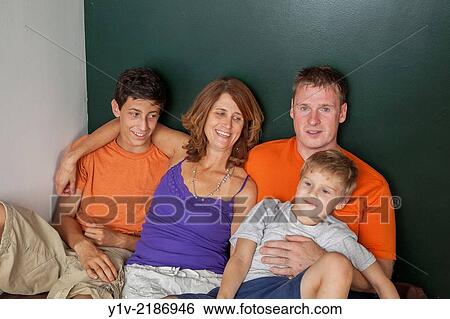 Parents with teen and young sons. View Large Photo Image Stock Photograph - Parents with teen and young sons.. Fotosearch