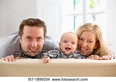 Parents with their six month year old baby View Large Photo Image Picture - Parents with their six month year old baby. Fotosearch