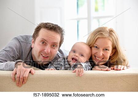 Parents with their six month year old baby View Large Photo Image Stock Image - Parents with their six month year old baby. Fotosearch