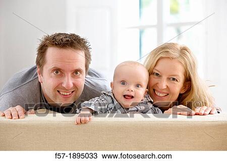 Parents with their six month year old baby View Large Photo Image Stock Image - Parents with their six month year old baby. Fotosearch