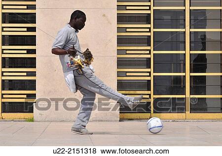 Paris, France, an African immigrant, souvenirs peddler, playing soccer by the Palais de Chaillot, Trocadero View Large Photo Image Stock Photo - Paris, France, an African immigrant, souvenirs peddler, playing soccer by the Palais de Chaillot, Trocadero. Fotosearch
