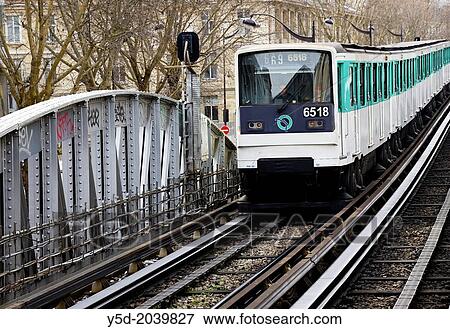 Stock Photo - Parisian metro arriving to Quai de la Gare station, Paris, France.. Fotosearch