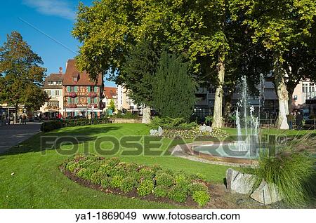 Stock Photo - Park and fountain, on Quai de la Sinn, Colmar, Haut-Rhin, Alsace, France. Fotosearch