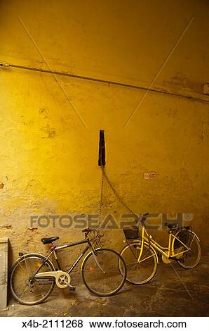 Parked bicycles Piazza Amfiteatro square Lucca city Tuscany region Italy Europe. View Large Photo Image Stock Photo - Parked bicycles Piazza Amfiteatro square Lucca city Tuscany region Italy Europe.. Fotosearch