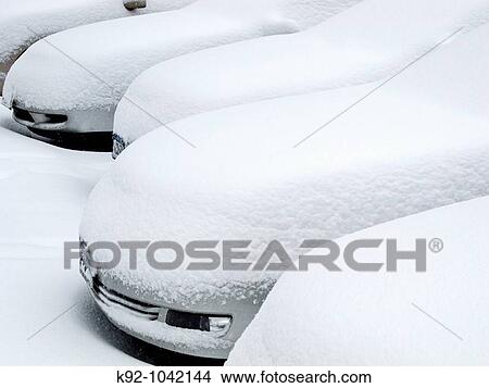 Parked cars buried in snow. View Large Photo Image Picture - Parked cars buried in snow.. Fotosearch