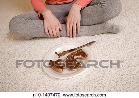 Partially eaten bagel in front of a preteen girl View Large Photo Image Stock Image - Partially eaten bagel in front of a preteen girl. Fotosearch