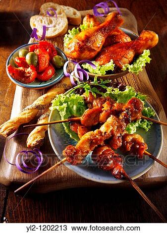 Party buffet food with chicken satay and BBQ drum sticks View Large Photo Image Stock Image - Party buffet food with chicken satay and BBQ drum sticks. Fotosearch