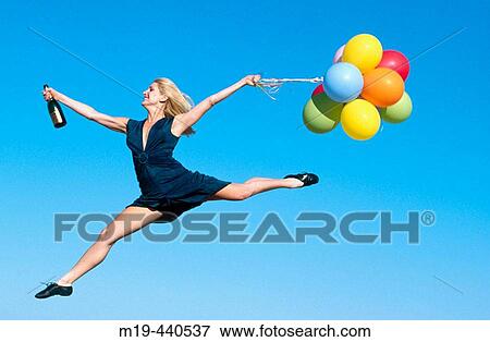 party girl jumping with balloons View Large Photo Image Stock Photo - party girl jumping with balloons. Fotosearch