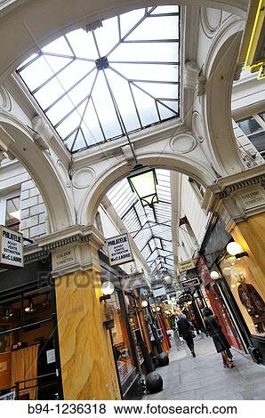 Passage des Panoramas (1799) roofed commercial passageway between Montmartre boulevard and Saint-Marc street, Paris, France View Large Photo Image Stock Photo - Passage des Panoramas (1799) roofed commercial passageway between Montmartre boulevard and Saint-Marc street, Paris, France. Fotosearch